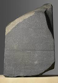 The Rosetta Stone helped in translating which ancient scripts?