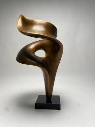 Which sculptor created monumental abstract forms in bronze or marble?