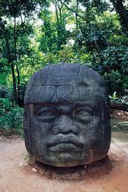 The Olmec civilization is known for creating large sculptures of what?