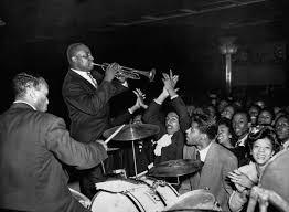 What famous jazz club was located in Harlem during the Harlem Renaissance?