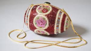 Which designer is known for their eccentric handbag designs?