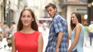 Which meme features a man looking at another woman, while his partner looks displeased?