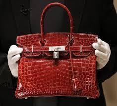 Which brand is known for its iconic Birkin bag?