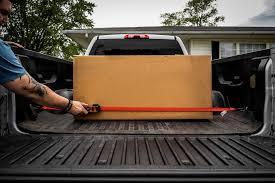 How can you secure items in a truck bed?