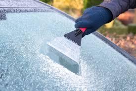 What should you use to clear your windshield during snow?