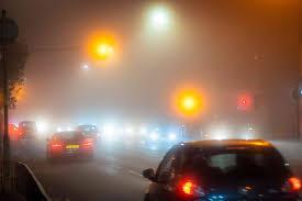 When driving in foggy conditions, what lights should you use?