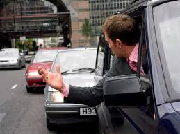 What is the first step to take when encountering an aggressive driver?