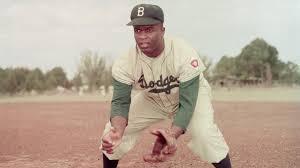 In what year did Jackie Robinson break the baseball color line?