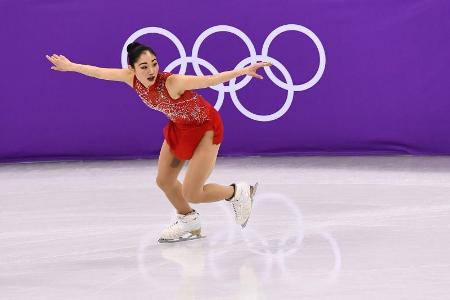 Which American figure skater is the first woman to land a triple axel in competition?