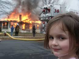 Which meme features a girl smiling in front of a house on fire?