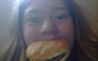 Hey, um...I'm back. This is a bit weird and all but...I came back. Here's me with a burger in my mouth.