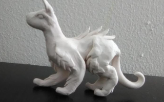 Hey any color suggestions for this sculpture? I made this dog, cat, dragon thing and I don't know what colors to paint it (And yes I know the face is a little, just a little screwed up).