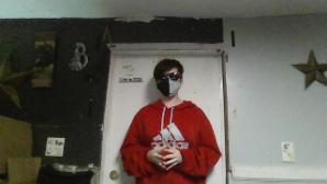 heres me in ranboo cosplay and standing next to a door